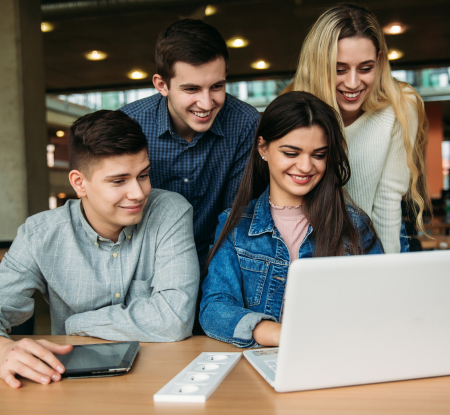 young people looking at a laptop